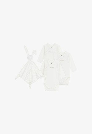Three white long-sleeve bodysuits and a rabbit-themed security blanket with a dotted pattern and knotted corners.