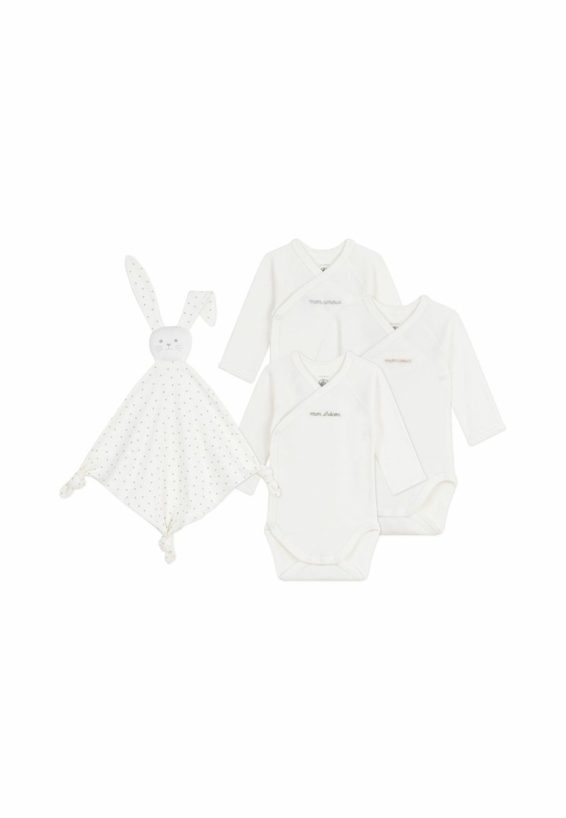 Trois bodysuits blancs à manches longues et une couverture de sécurité sur le thème du lapin, avec un motif à pois et des coins noués.