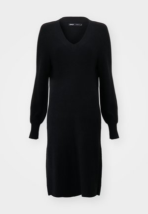 Svart strikket kjole med V-hals, lange ballongsleeves og sideslitz. Stoffet har en myk tekstur og en løs silhuett.