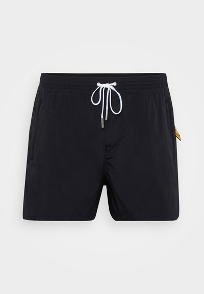 Black swim shorts made of lightweight fabric, featuring a drawstring waistband, plastic tip accents, and a side logo patch.