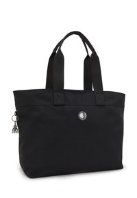 Sort tote bag lavet af slidst�ærkt stof, med to solide hanke, et rundt logo og en charm ved siden af. Glat tekstur med et enkelt design.