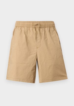 Beige knielange shorts met elastische tailleband en trekkoord, zijzakken en een losse pasvorm, weergegeven op een effen achtergrond.