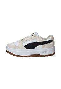 Sneakers with a white leather and tan suede upper, featuring a black side stripe, rubber sole, and rounded toe design.