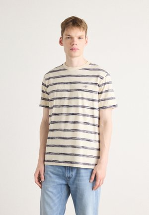 Beige short-sleeve T-shirt with navy horizontal stripes and a round neckline; features a small logo detail on the chest.