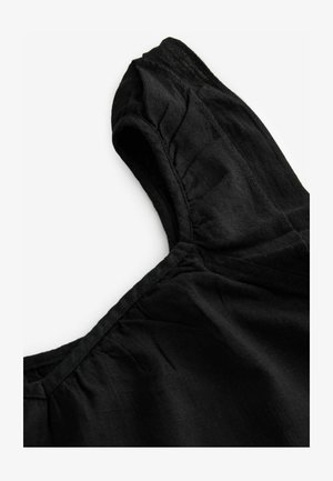 Sort linnedragt med rund halsudskæring, korte ærmer og samlede detaljer ved skuldrene og brystet. Glat tekstur, let materiale.