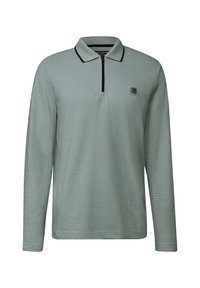 Světle šedá polokošile s dlouhým rukávem a černým límečkem, krátkým předním zipem a malou čtvercovou nášivkou na levé hrudi.