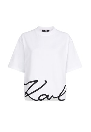 White cotton T-shirt featuring a black cursive logo on the front. Short sleeves and a relaxed fit with a round neckline.