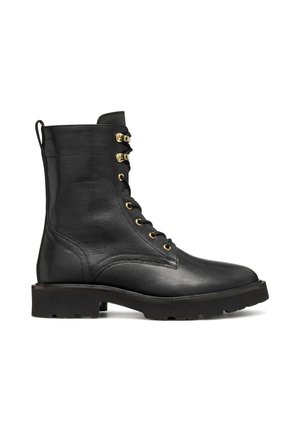 Black leather ankle boots feature a lace-up front with gold hardware, a textured upper, and a thick rubber sole for added durability.