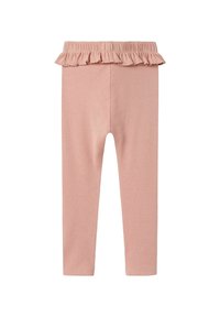 Ljusrosa leggings i ett mjukt, stretchigt material, med en volangmidja och en figurnära design. Slät yta och enkel siluett.
