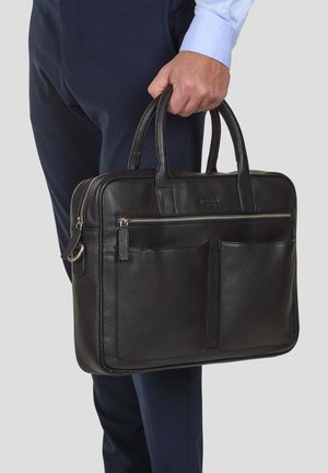 Black leather briefcase with two top handles, smooth zipper closure, front pockets, textured surface, and silver hardware accents.
