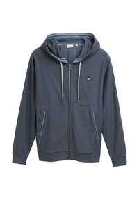 Mørkeblå zip-up hættejakke med et tekstureret materiale, justerbar snorhætte, to frontlommer og et lille logo på brystet.