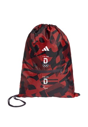 Red and black drawstring bag with abstract pattern, Adidas logo, Team D Olympic and Paralympic symbols, and front zipper pocket.