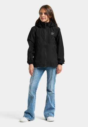 Black lightweight jacket with a zip front and hood, featuring a logo on the chest. Paired with blue flared jeans and white sneakers.