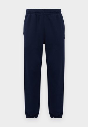 Navy blue sweatpants with elastic waistband and cuffs, straight leg fit, displayed against a plain light background.