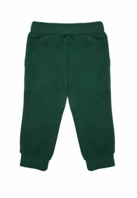 Zielone bawełniane spodnie dresowe z elastycznym pasem i ściągaczami, o gładkiej fakturze i prostym, nieozdobionym wzornictwie.