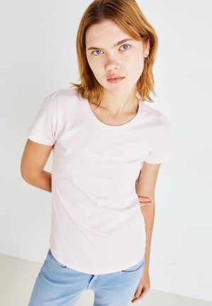 Pink short-sleeve t-shirt made of cotton with a round neckline, featuring a white logo print "Pepe Jeans London" on the front.