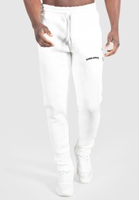 Hvide sweatpants med elastisk talje og sort "SMILODOX" logo på venstre lår, med en glat, blød tekstur.