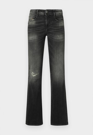 Schwarze, ausgewaschene Flared-Jeans mit Fronttaschen, Knopfverschluss und einem abgenutzten Fleck am linken Oberschenkel.