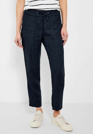Pantalon en mélange de lin marine avec une taille élastique, cordon de serrage et poches latérales. Présente une jambe fuselée et une coupe décontractée.