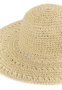Chapeau de soleil beige à large bord en crochet avec un motif ajouré autour du bord pour une bonne respirabilité.