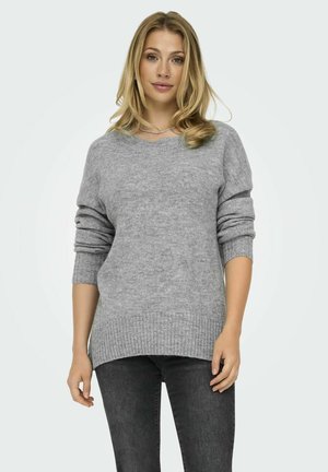 Jersey gris de punto con escote en V, mangas largas y dobladillo acanalado. Textura suave, corte relajado y diseño de longitud media.