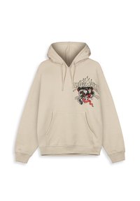 Sudadera beige con un bolsillo frontal, capucha con cordón y un diseño de tigre bordado en el lado izquierdo, con colores y detalles llamativos.