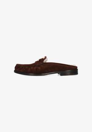 Brown suede slip-on loafer with black sole and white fur lining visible inside heel and collar.