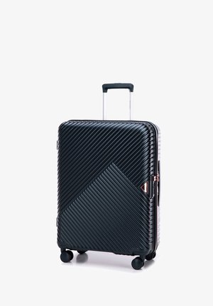 Zwarte harde kofferschaal met diagonale geribbelde textuur, roségouden accenten, uitschuifbare handgreep en vier wielen voor gemakkelijke mobiliteit.