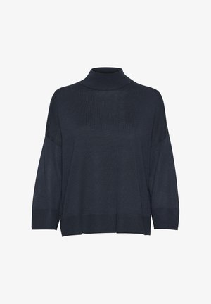 Tamsiai mėlynas megztas golfas, laisvo kirpimo, su nuleistomis petnešomis ir rūbų galuose. Minkšta medžiaga, minimalus dizainas, nematyti raštai.