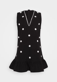 Abito nero senza maniche con scollatura a V, decorato con ricami bianchi a margherita e un orlo arricciato. Presenta una chiusura con zip sul retro.