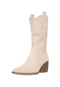 Beżowe zamszowe kowbojki z ostro zakończonym noskiem, przeszyciami oraz podwyższonym obcasem. Posiadają pętle do łatwego zakładania.