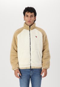 Tommy Jeans - FLUFFY REVERSIBLE JACKET - Fliisjakk - relic tan/ancient white Väikepilt 1