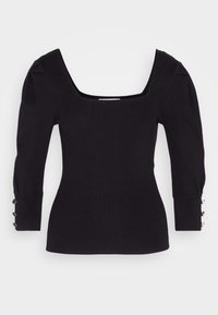 Schwarzes, geripptes Langarmoberteil mit quadratischem Ausschnitt, gepufften Schultern und Knopfdetails an den Ärmeln. Weiche Textur und figurbetontes Design.