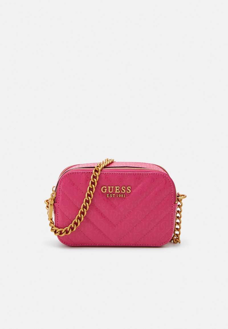Pink quilted crossbody bag with gold chain strap, featuring embossed logo and zipper closure, rectangular shape with chevron pattern.