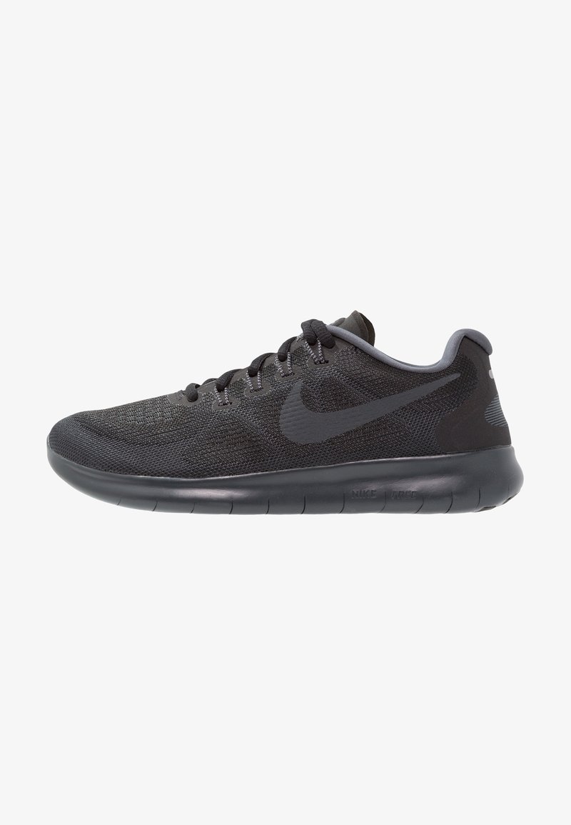 Black athletic shoe with a mesh upper, tonal Nike swoosh, flexible rubber sole, and textured detailing; features gray lacing and accent.