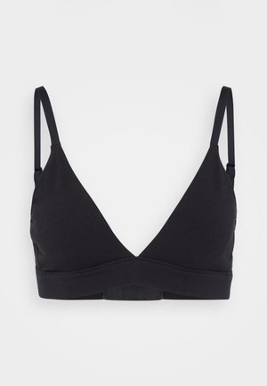 Black, seamless bralette with a v-neckline, adjustable straps, and soft stretchy fabric for comfort. No underwire. Simple and minimalist design.