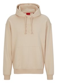 Felpa con cappuccio beige realizzata in tessuto morbido, dotata di tasca frontale e logo "HUGO" in rilievo. I polsini e l'orlo a coste completano il design.