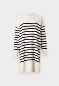 Cream sweater dress with black stripes, long sleeves, ribbed cuffs, and rounded neckline. Soft texture; knee-length design.