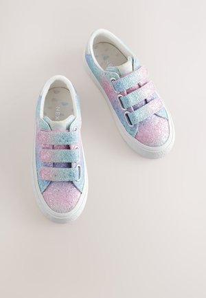 Children’s sneakers with pastel rainbow glitter and three Velcro straps on a light background, angled with toes pointing up.