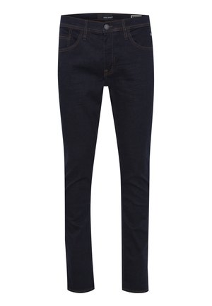 Tumši zili džinsi, kas izgatavoti no denima, ar piecām kabatām, rāvējslēdzēju un kontrasta šuvēm. Šaura piegriezuma dizains ar gludu tekstūru.