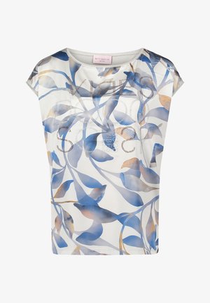 T-shirt met korte mouwen in een witte stof met blauwe en beige bladerenpatronen. "Good Vibes" gedrukt in zilveren rhinestones over de voorkant.