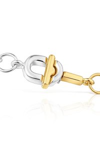 Chiusura in metallo bicolore con corpo argentato lucido e accenti dorati, dotata di meccanismo di bloccaggio sicuro e bordi lisci e arrotondati.