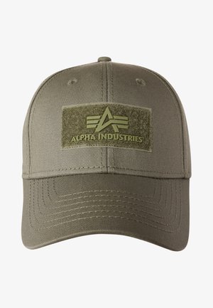 Olive green cap made of fabric, featuring a textured patch with the "Alpha Industries" logo in a muted green color and angled lines.