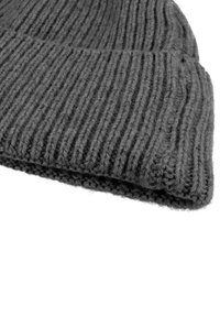 Gray knitted beanie with ribbed texture, featuring a rolled hem and a soft, thick yarn. Accentuated with visible stitching details.