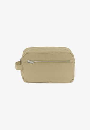 Rectangular beige toiletry bag with front zippered pocket, top zipper, and side handle, made of smooth fabric.