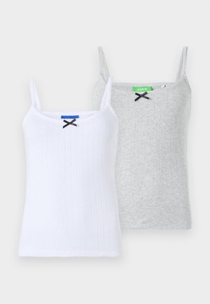 Two ribbed camisoles: one white with a black bow accent and one grey with a black bow, both featuring thin adjustable straps.