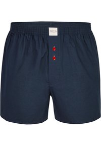 Námořnické modré bavlněné trenýrky s elastickým pasem, na přední straně mají tři červené knoflíky a malou etiketu nad knoflíky.