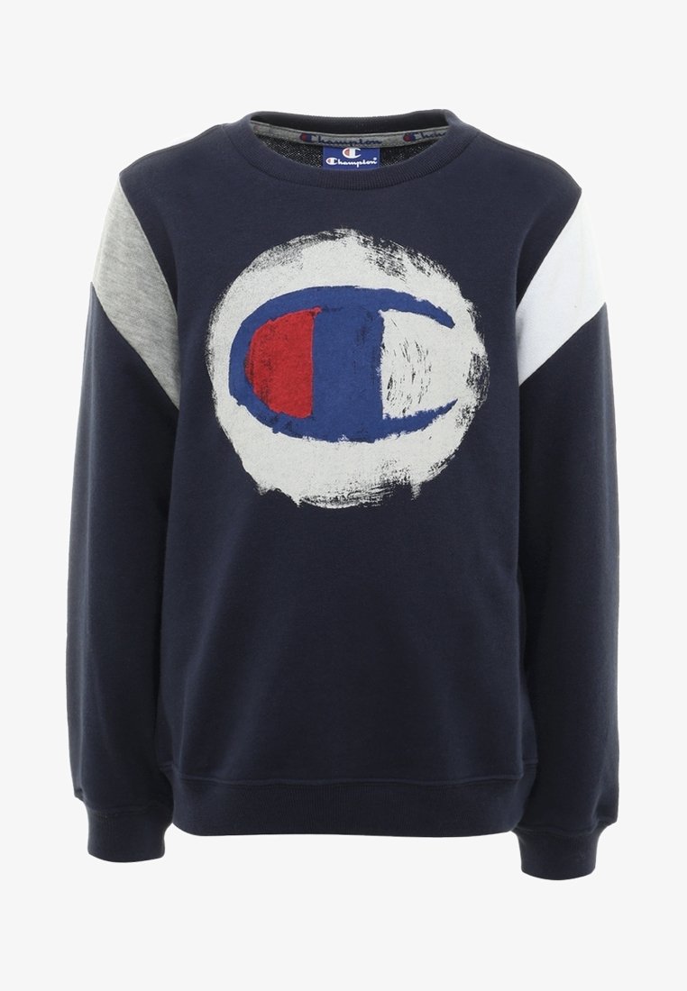 Laivastonsininen huppari, jossa on harmaita ja valkoisia yksityiskohtia, ja jonka keskiössä on suuri ympyrälogo punaisena, sinisenä ja valkoisena. Valmistettu pehmeästä kankaasta.