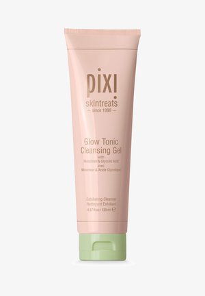 Tube rose avec un capuchon vert, étiqueté "Gel Nettoyant Pixi Glow Tonic." Surface texturée, 135 ml, contenant des détails sur les ingrédients et l'utilisation.