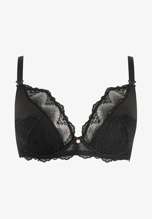Zwarte bh met een kanten overlay, draadloos ontwerp, verstelbare bandjes en een decoratieve strik op de bandjes. Gecoate textuur met golvende randen.